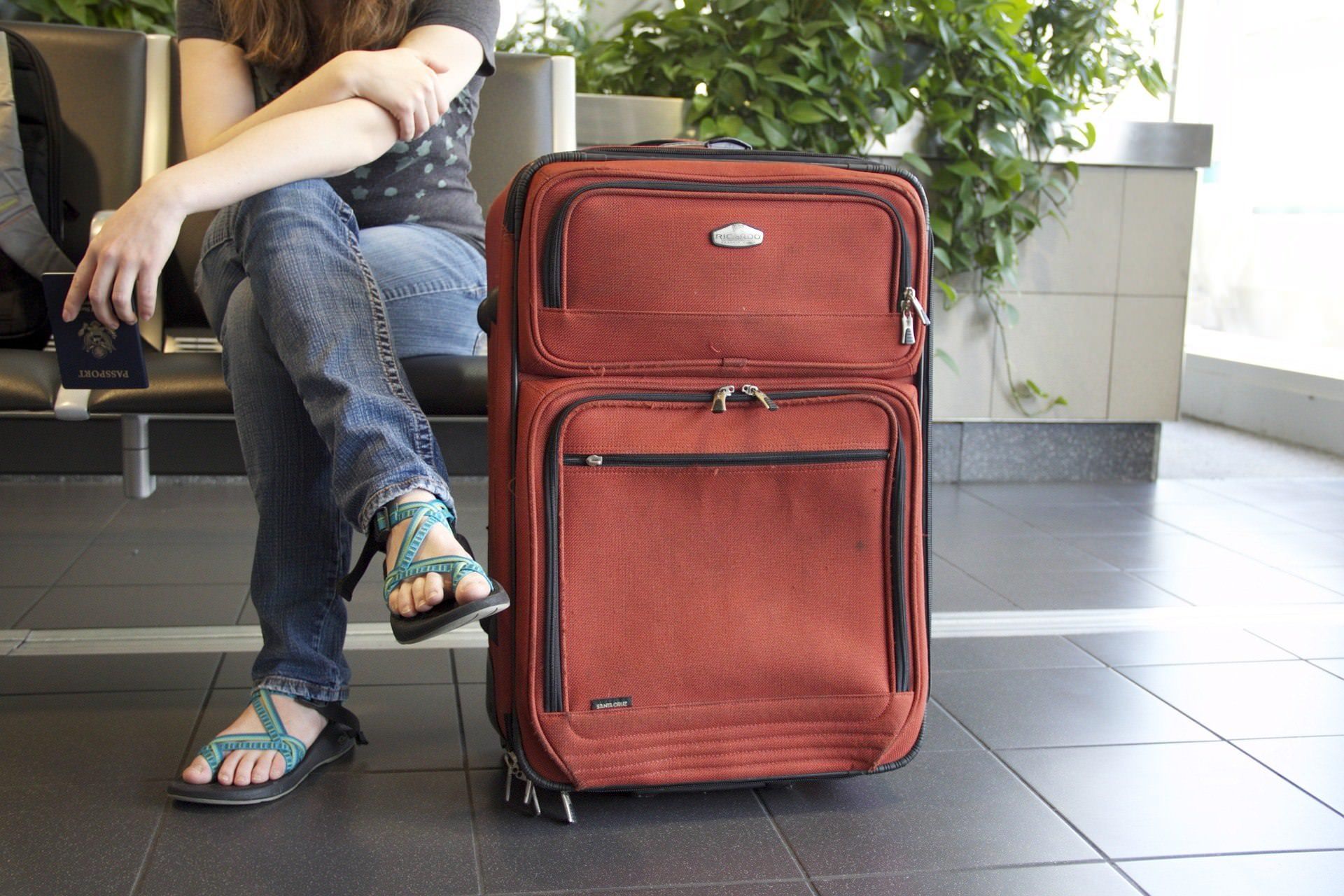 Girl and suitcase at airport