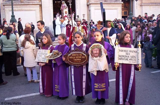 Girls pose as part of a Maltese Easter procession
